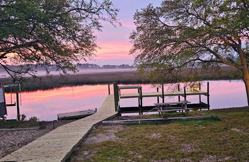 Carrabelle House | Riverfront Retreat- Fishing Dock, Screen Porch, Shaded Lawn, Adirondack Chairs