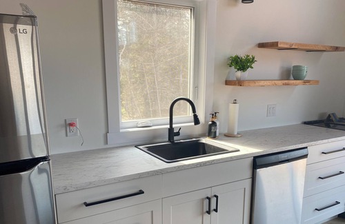 Alberton Cottage | Rivers End Retreat located on cascumpec river. Private hot tub and bunk house.