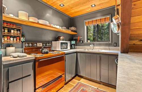 Rhododendron Cabin | Riverside A-frame in gated cabin community with private deck, woodstove, & W/D