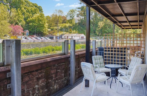 Cockermouth Cottage | Riverside apartment with private balcony and direct views over the river.