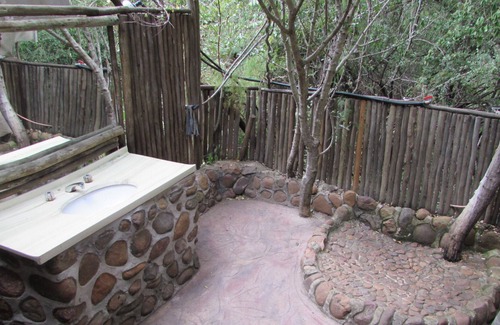 Thorny Bush Game Reserve House | Romantic canvas pad on river, share shower with monkeys and listen to the lions