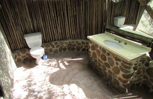 Thorny Bush Game Reserve House | Romantic canvas pad on river, share shower with monkeys and listen to the lions