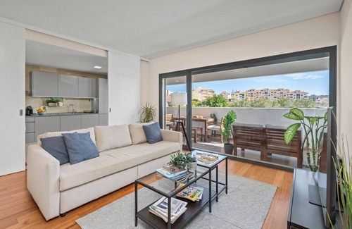 Faro Apartment | Rooftop Pools and Balcony Haven by HostWise