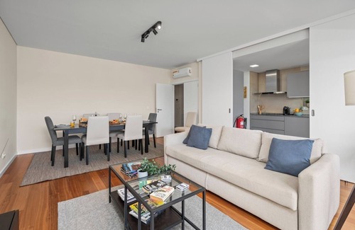 Faro Apartment | Rooftop Pools and Balcony Haven by HostWise