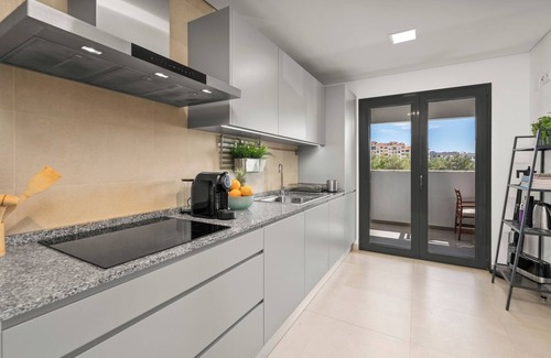 Faro Apartment | Rooftop Pools and Balcony Haven by HostWise