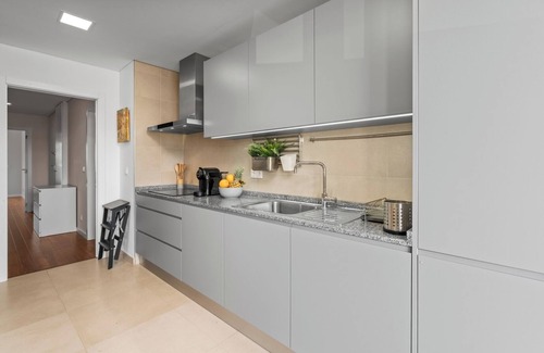 Faro Apartment | Rooftop Pools and Balcony Haven by HostWise