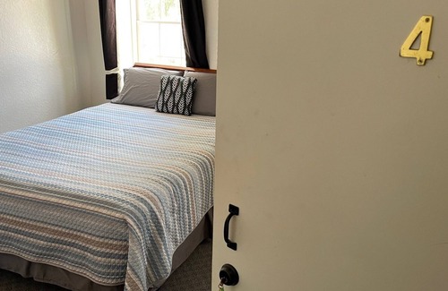 Spillville Apartment | Room 4: Sleep Where Prohibition Secrets Were Made - Historic Escape!