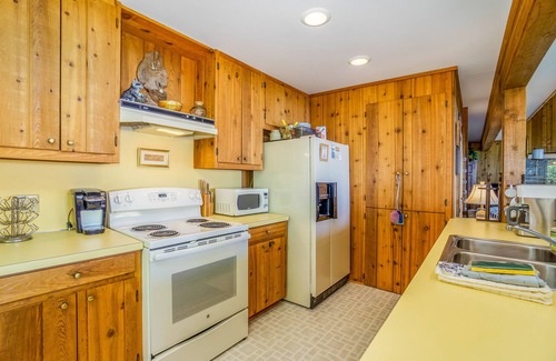 Lake Township House | Rustic dream-home w/lake views, wraparound deck, & wood-burning fireplace