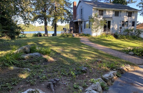 Northwood House | Rustic Lake front cottage nestled in the pines with a Golf Putting Green.