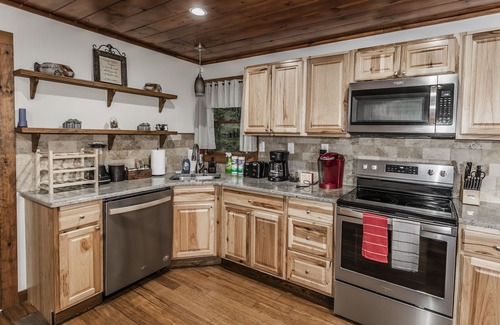 Sevierville Cabin | Rustic Lakefront Cabin near Smokies w/Hot Tub, Firepit, Pool Table + Views!