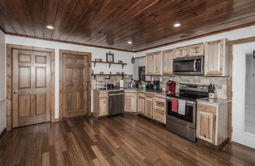 Sevierville Cabin | Rustic Lakefront Cabin near Smokies w/Hot Tub, Firepit, Pool Table + Views!