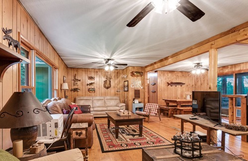 Presque Isle House | Rustic Lakeside Home with Dock, Firepit, Lake Views, and Screened-In Porch