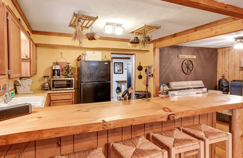 Presque Isle House | Rustic Lakeside Home with Dock, Firepit, Lake Views, and Screened-In Porch