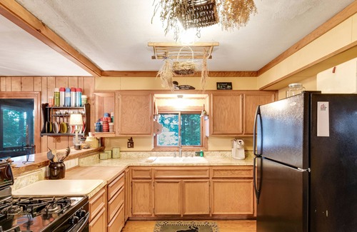 Presque Isle House | Rustic Lakeside Home with Dock, Firepit, Lake Views, and Screened-In Porch