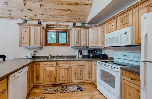 Mercer Cabin | Rustic resort cabin with lake views, deck & access to docks, canoe, paddle boats