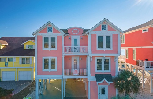 Holden Beach House | "Salty Pink Flamingo" is a stunning 6-bedroom, 4-bathroom oceanfront retreat with a private pool, hot tub, and elevator.