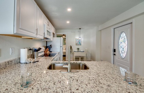 South Island House | Sand Dollar #1 - Downstairs Apt with Shared Pool on Canal by the Beach!