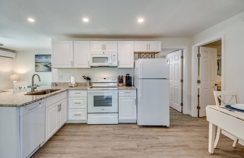 South Island House | Sand Dollar #1 - Downstairs Apt with Shared Pool on Canal by the Beach!