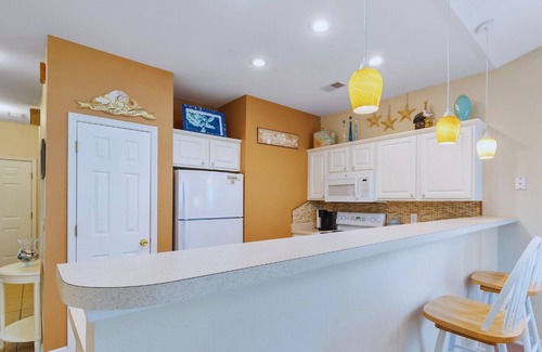 Sunset Beach Condo | Sandpiper Bay 3 bedroom/2 bath condo with stunning water/course views!