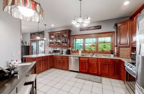 Rock Harbor House | Scenic 6BR lakefront home in cove with private dock, boat slips, hot tub-Dogs ok