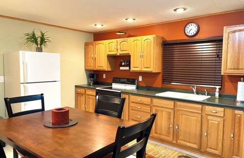 Nekoosa Cabin | Scenic riverfront cottage with boat landing and docks.