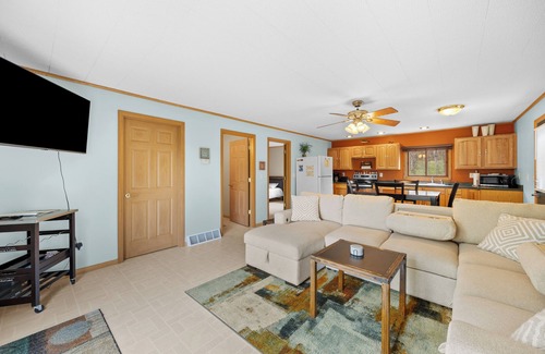 Nekoosa Cabin | Scenic riverfront cottage with boat landing and docks.