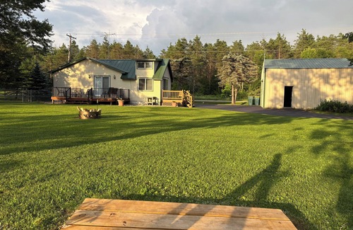 Nekoosa Cabin | Scenic riverfront cottage with boat landing and docks.