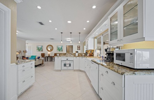 Deerfield Beach House | Screened-In Heated Pool and 5 min from the beach. Child friendly.