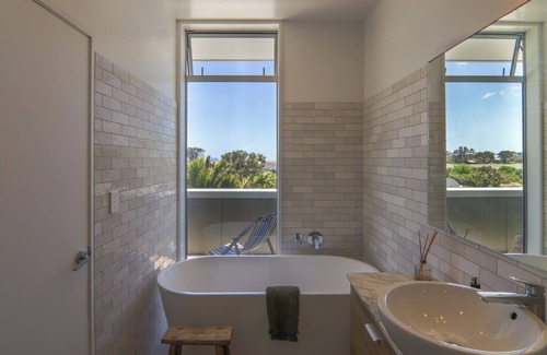 Waipu Apartment | Sea and rural views from your private deck, surrounded by tropical gardens