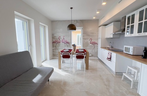 Chioggia Apartment | Seafront Modern Flamingo Suite by Ca-sa Check