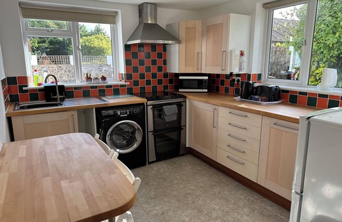 Minehead Apartment | Seaside Escape: Golf & Coast Path Retreat with private entrance & secure garden.