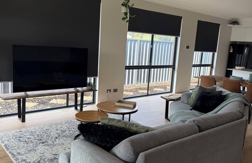 Singleton House | Seaside EscapenKick back and relax in this calm, stylish space.