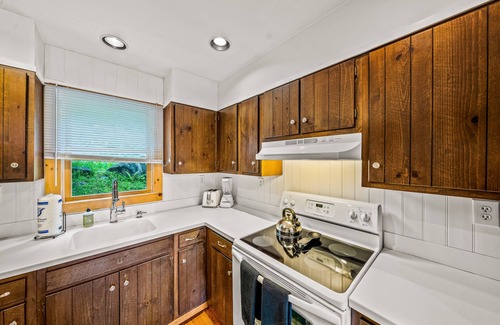 Brant Lake House | Secluded cabin with dock, wraparound deck, gorgeous view & enclosed porch