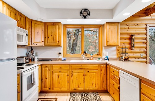 Friendship Cabin | Secluded, dog-friendly home with tree-lined view, firepit, fireplace, & deck