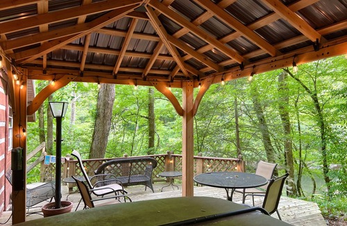 Gatlinburg - Pigeon Forge Cabin | Secluded Riverfront Cabin Sounds of the River Screened Porch Gazebo Hot Tub