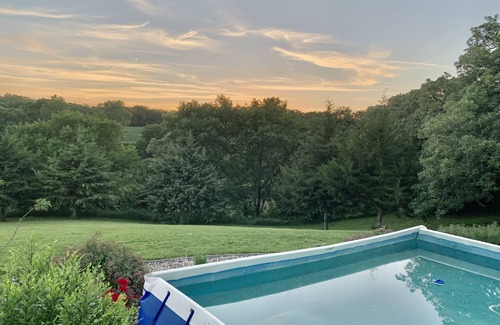 Honey Creek House | Secluded, spacious, hilltop acreage home with stunning views of Omaha skyline
