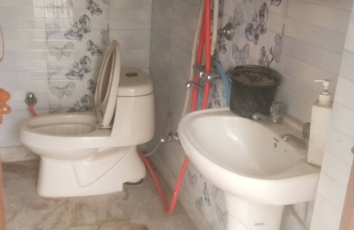 Mehrauli House | semi furnished Flat For Rent with one queen size bed and 4 chairs dining table