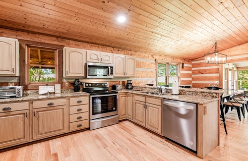Kodak Cabin | Serene cabin with pool, hot tub, game room, fireplace, & free attraction tickets