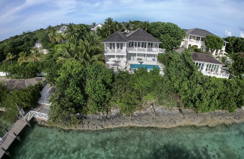 Dunmore Town House | Serene waterfront house w pool, dock & beautiful sunsets - 5 min walk to beach.
