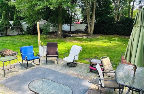 Coram Apartment | Serenity Haven: Cozy 2-Bedroom Home with Spacious Living & Big Backyard