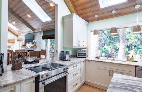 West Beach House | Short Stroll to Beach! Exquisitely Renovated Home w/Pool & Hot Tub, Spacious Deck & Lagoon Views!