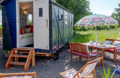 Halfway House House | Shrawardine Station Train Carriage sleeps 4 Fishing and Wild Swimming
