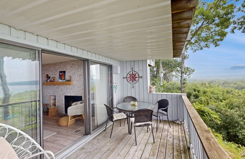 Maple City Condo | Single-level lakefront hideaway with a deck, fireplace, & washer/dryer