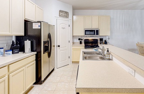 Apollo Beach House | Single-story home with screened patio, grill, AC, & W/D - great location