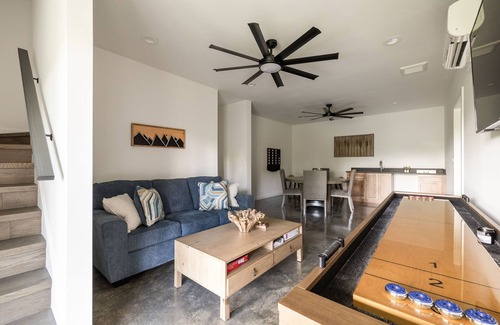 Young Harris Cabin | Skip’s Hideaway is a 4BR/3.5BA retreat for 10 in the North Georgia mountains. Enjoy fiery fall views, a private hot tub, gas fireplace, game room, and fenced yard for dogs. Perfect for cozy nights, family fun, and leaf-filled adventures.