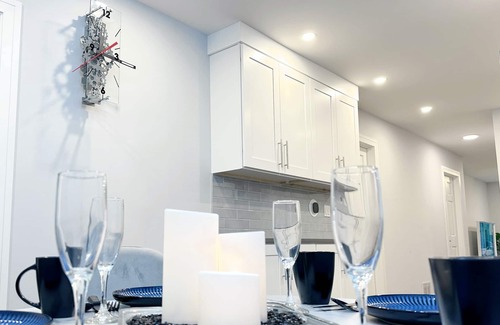 Irving Park Apartment | Sleek 3BR: Minimalist Style, Fire Pit, 65-inch TV, & Tech-Ready!