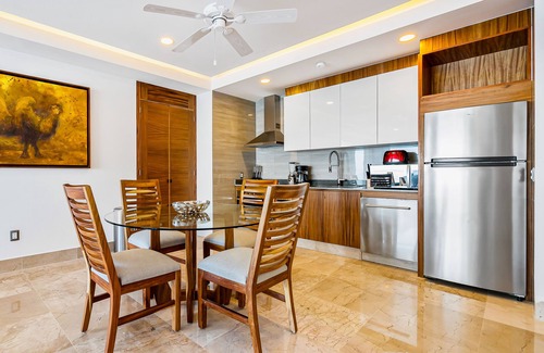 Mismaloya Condo | Sleek 9th-floor condo with wraparound balcony, ocean views & pool