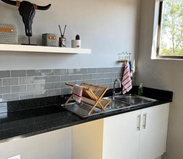 Douglasdale Apartment | Sleek, Smart Cottage in Douglasdale