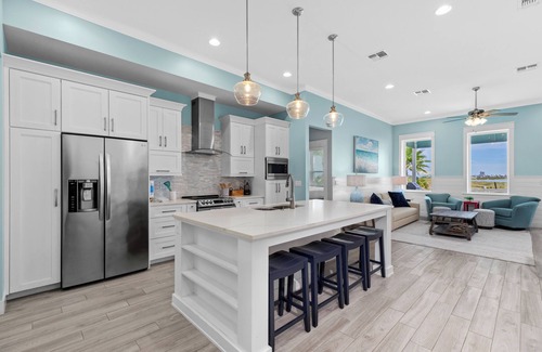 The Shores Cottage | Sol Y luna home at The Shores, sandy steps to the bay, short walk to the beach