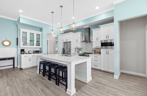 The Shores Cottage | Sol Y luna home at The Shores, sandy steps to the bay, short walk to the beach